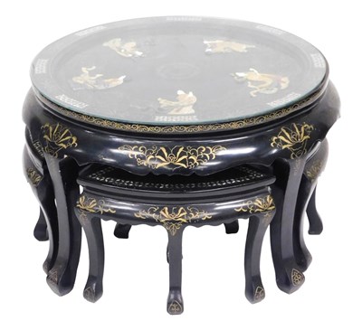 Lot 782 - A Chinese black lacquer nest of circular table...