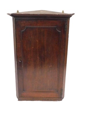 Lot 809 - A George III oak wall hanging corner cupboard,...