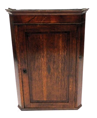 Lot 810 - A Georgian oak and mahogany wall hanging...