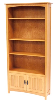 Lot 828 - A Corndell light oak bookcase, with three open...