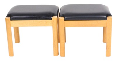 Lot 834 - A pair of light oak stools, with black...