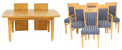 Lot 842 - A light oak draw leaf dining table, of...