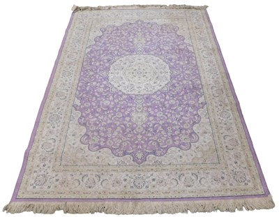 Lot 849 - A continental Persian style purple and cream...