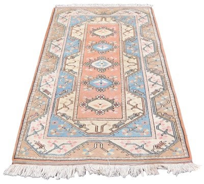 Lot 850 - A Persian red and cream ground rug, the...