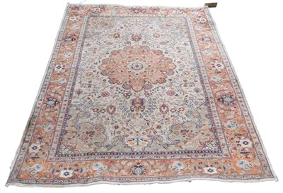 Lot 852 - A Tabriz red and cream ground rug, with a...