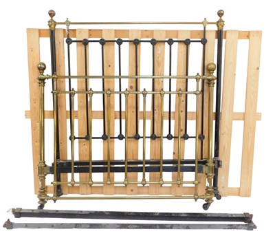 Lot 309 - A Victorian brass and ebonised bed, the head...