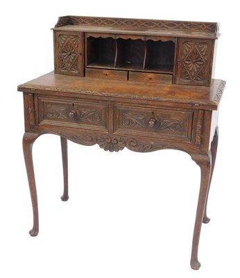Lot 353 - A 19thC Continental carved oak lady's writing...