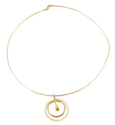 Lot 515 - A 9ct gold concentric circle and drop pendant,...