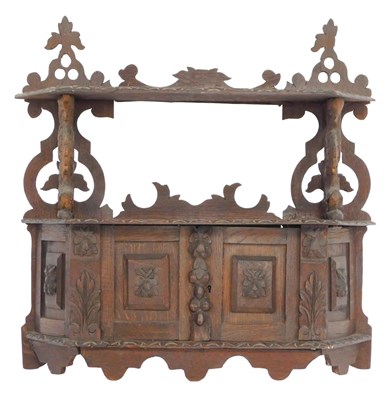 Lot 370 - A late 19th/early 20thC carved oak wall...