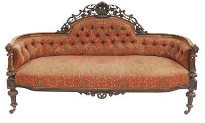 Lot 394 - A Victorian walnut show frame sofa, the raised...