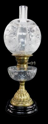 Lot 113 - A Victorian brass oil lamp, the globular clear...