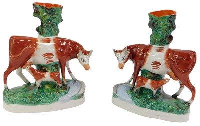 Lot 126 - A pair of 19thC Staffordshire spill vases,...