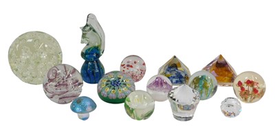 Lot 132 - A group of glass paperweights, to include a...