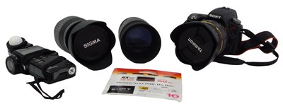 Lot 140 - A Sony A33 DSLR camera, together with a Tamron...