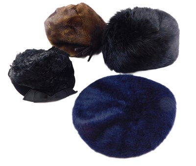 Lot 131 - A collection of fur and faux fur hats,...