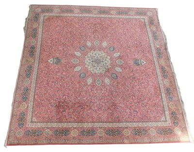 Lot 446 - A Persian carpet, red ground with a central...