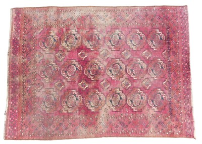 Lot 448 - An Afghan rug, red ground with three rows of...