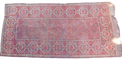 Lot 449 - A Turkish runner, red ground with three rows...