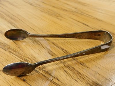 Lot 2032 - A pair of silver sugar tongs, plain design,...