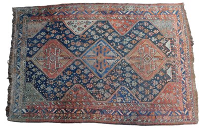 Lot 454 - A Qashqai rug, blue and red ground, with three...