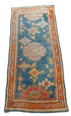Lot 458 - A Turkish rug, teal ground decorated with...