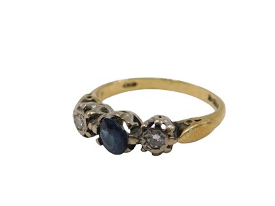 Lot 52 - An 18ct gold sapphire and diamond three stone...