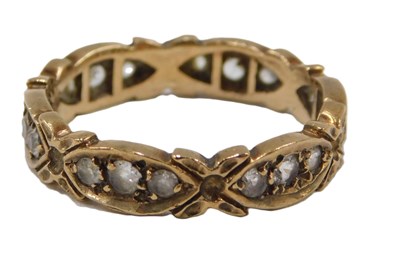 Lot 61 - An eternity ring, set with tiny diamonds, in...