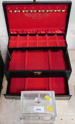 Lot 2004 - A Perspex lidded jewellery, and another...