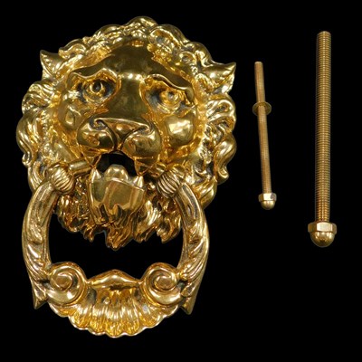 Lot 485 - A cast polished brass lion's head door knocker,...