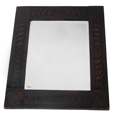 Lot 499 - A late 19th/early 20thC carved oak wall mirror,...