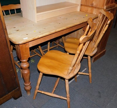 Lot 1009 - A pine kitchen table, the rectangular top with...