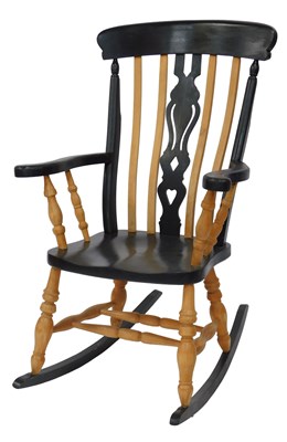 Lot 519 - A beech and black painted lath back rocking...