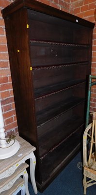 Lot 1010 - An open bookcase, the top with a moulded edge...