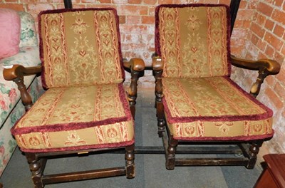 Lot 1015 - A pair of Ercol Old Colonial lounger armchairs,...