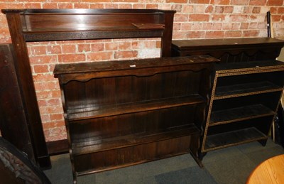 Lot 1018 - An oak open bookcase, the top with a moulded...
