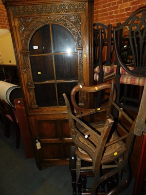 Lot 1028 - A 20thC carved oak standing corner cabinet,...
