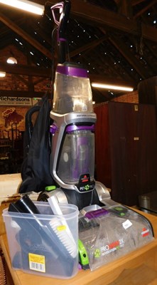 Lot 1031 - A Bissell upright carpet cleaner, with...