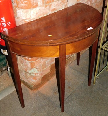 Lot 1043 - A mahogany D end fold over table, on square...