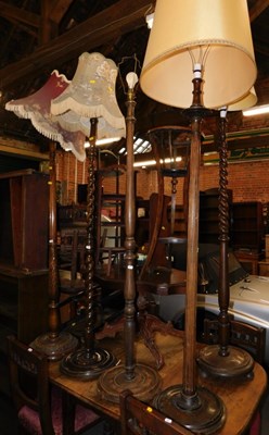 Lot 1045 - Five standard lamps, each of differing design,...