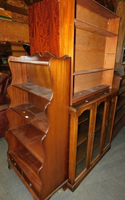 Lot 1050 - A 20thC mahogany waterfall bookcase, with two...
