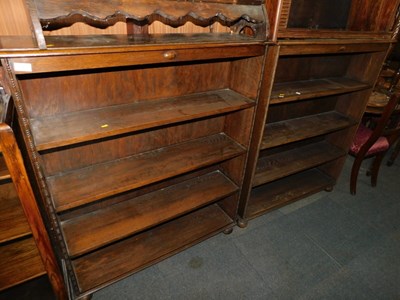 Lot 1051 - A pair of 20thC oak bookcases, the top with a...