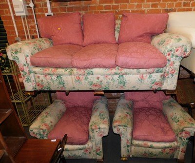 Lot 1053 - A pink rose upholstered two seater sofa,...