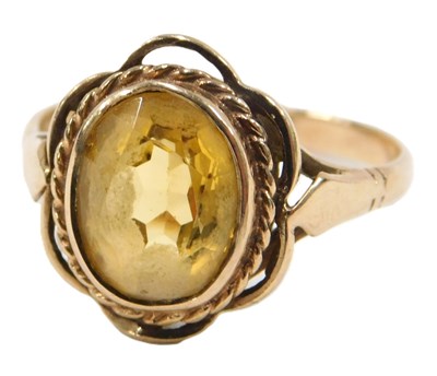 Lot 63 - A floral cluster ring, the central oval...