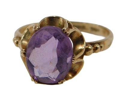 Lot 65 - A 9ct gold dress ring, set with oval cut...