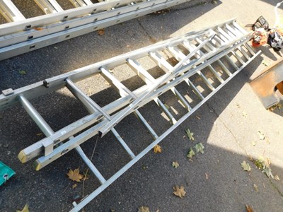 Lot 1104 - A metal extending ladder.