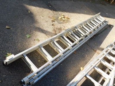 Lot 1105 - A metal extending ladder.
