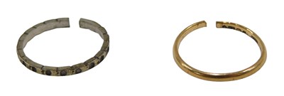 Lot 69 - A 22ct gold wedding band, cut, 1.1g, and a...