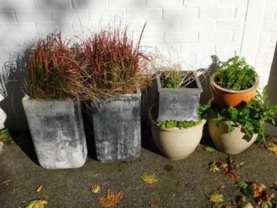 Lot 1116 - A group of plant pots, to include two grey...