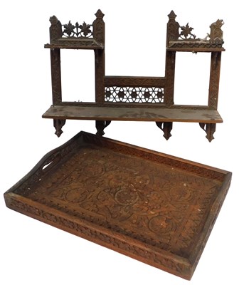 Lot 539 - An Indian carved wooden tray, decorated with...