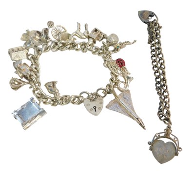 Lot 253 - Two silver charm bracelets, comprising a curb...